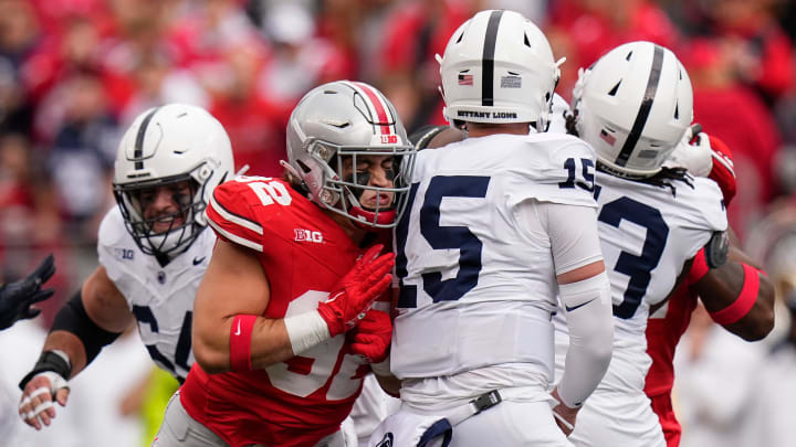Oct 21, 2023; Columbus, Ohio, USA; Ohio State Buckeyes defensive end Caden Curry (92) hits Penn State Nittany Lions quarterback Drew Allar (15) during the NCAA football game at Ohio Stadium.