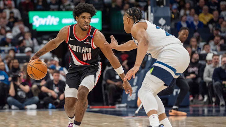 Feb 8, 2025; Minneapolis, Minnesota, USA; Portland Trail Blazers guard Scoot Henderson (00) is defended by Minnesota Timberwolves guard Jaylen Clark (22) in the second quarter at Target Center. Mandatory Credit: Matt Blewett-Imagn Images Feb 8, 2025; Minneapolis, Minnesota, USA; Portland Trail Blazers guard Scoot Henderson (00) is defended by Minnesota Timberwolves guard Jaylen Clark (22) in the second quarter at Target Center. Mandatory Credit: Matt Blewett-Imagn Images