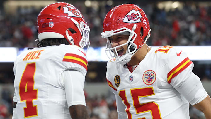 Nov 27, 2025; Arlington, Texas, USA; Kansas City Chiefs wide receiver Rashee Rice (4) and Kansas City Chiefs quarterback Patrick Mahomes (15) celebrate after a play against the Dallas Cowboys during the first quarter at AT&T Stadium. Mandatory Credit: Kevin Jairaj-Imagn Images
