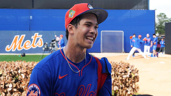 Feb 16, 2026; Port St. Lucie, FL, USA; New York Mets pitcher Jonah Tong (21) smiles as he takes a picture with fans during spring training at Clover Park. Mandatory Credit: Jim Rassol-Imagn Images Feb 16, 2026; Port St. Lucie, FL, USA; New York Mets pitcher Jonah Tong (21) smiles as he takes a picture with fans during spring training at Clover Park. Mandatory Credit: Jim Rassol-Imagn Images