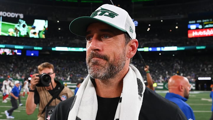 Aug 24, 2024; East Rutherford, New Jersey, USA; New York Jets quarterback Aaron Rodgers (8) walks on the field following the game against the New York Giants at MetLife Stadium. Mandatory Credit: Rich Barnes-USA TODAY Sports