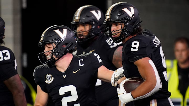 Vanderbilt tight end Eli Stowers (9) celebrates his touchdown against Ball State with quarterback Diego Pavia (2) during the second quarter at FirstBank Stadium in Nashville, Tenn., Saturday, Oct. 19, 2024.