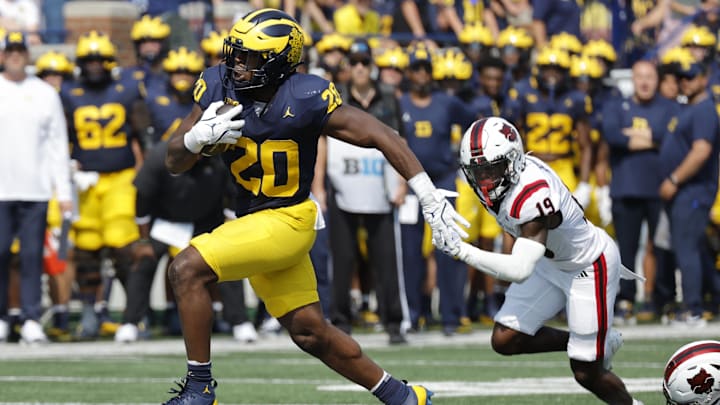Sep 14, 2024; Ann Arbor, Michigan, USA; Michigan Wolverines running back Kalel Mullings (20) runs the ball against the Arkansas State Red Wolves during the first half at Michigan Stadium. Sep 14, 2024; Ann Arbor, Michigan, USA; Michigan Wolverines running back Kalel Mullings (20) runs the ball against the Arkansas State Red Wolves during the first half at Michigan Stadium.