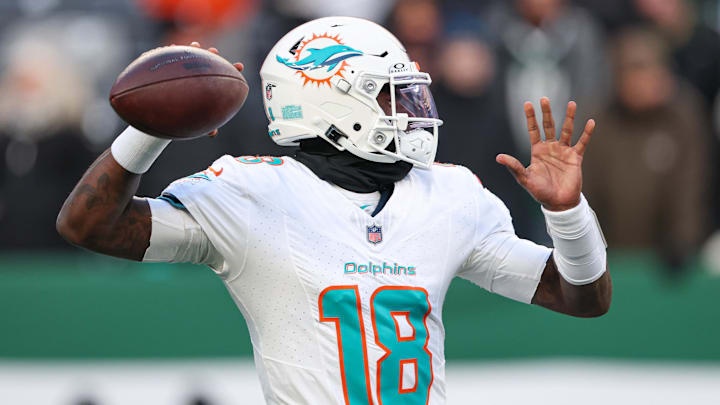 Jan 5, 2025; East Rutherford, New Jersey, USA; Miami Dolphins quarterback Tyler Huntley (18) warms up before the game against the New York Jets at MetLife Stadium. Mandatory Credit: Vincent Carchietta-Imagn Images