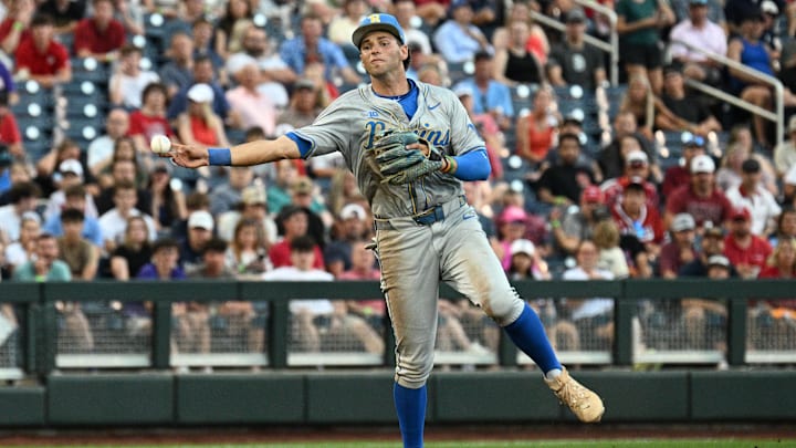 Jun 17, 2025; Omaha, Neb, USA; UCLA Bruins shortstop Roch Cholowsky (1) throws to first base against the Arkansas Razorbacks during the third inning at Charles Schwab Field. Mandatory Credit: Steven Branscombe-Imagn Images Jun 17, 2025; Omaha, Neb, USA; UCLA Bruins shortstop Roch Cholowsky (1) throws to first base against the Arkansas Razorbacks during the third inning at Charles Schwab Field. Mandatory Credit: Steven Branscombe-Imagn Images