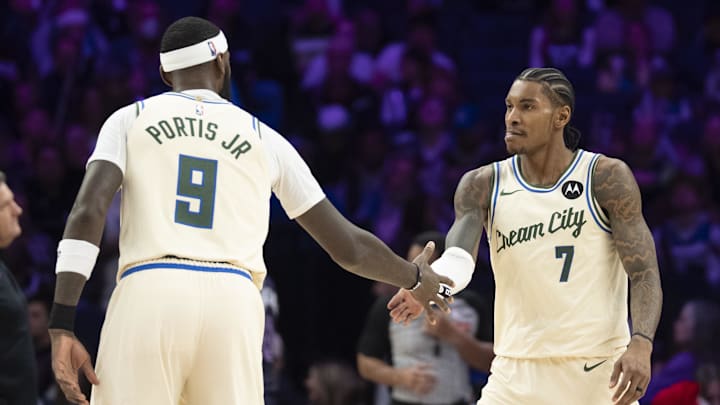 Dec 21, 2025; Minneapolis, Minnesota, USA; Milwaukee Bucks guard Kevin Porter Jr. (7) celebrates with Milwaukee Bucks forward Bobby Portis (9) after making a shot against the Minnesota Timberwolves in the second half at Target Center. Mandatory Credit: Jesse Johnson-Imagn Images