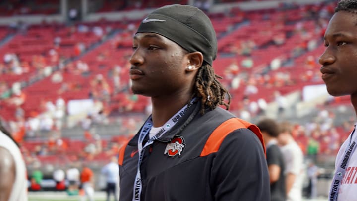 Sept. 21, 2024; Columbus, Ohio, USA; Glenville linebacker Cincere Johnson watches warm-ups before Ohio State's game against the Marshall University Thundering Herd at Ohio Stadium.