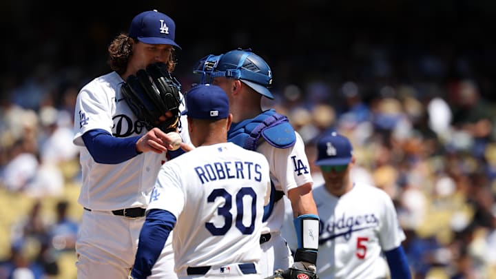 Apr 29, 2026; Los Angeles, California, USA;  Los Angeles Dodgers pitcher Tyler Glasnow (left) hands the ball to manager Dave Roberts (30) during the sixth inning against the Miami Marlins at Dodger Stadium. Mandatory Credit: Kiyoshi Mio-Imagn Images