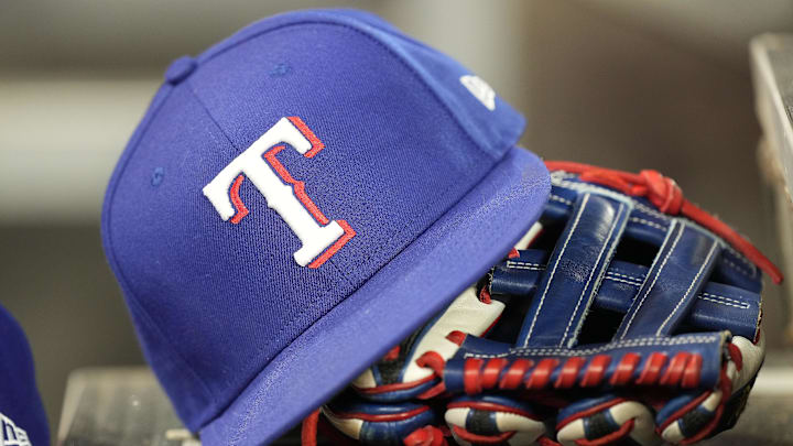 A hat and glove of a Texas Rangers player 