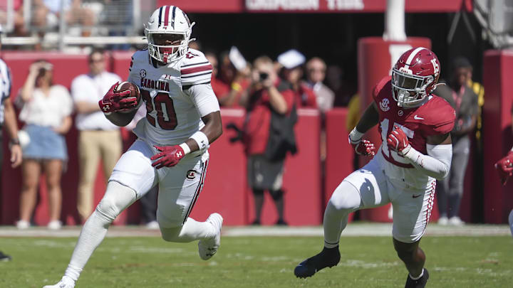 Oct 12, 2024; Tuscaloosa, Alabama, USA; South Carolina Gamecocks tight end Michael Smith (20) runs away from Alabama Crimson Tide linebacker Justin Jefferson (15) at Bryant-Denny Stadium. Mandatory Credit: Gary Cosby Jr.-Imagn Images Oct 12, 2024; Tuscaloosa, Alabama, USA; South Carolina Gamecocks tight end Michael Smith (20) runs away from Alabama Crimson Tide linebacker Justin Jefferson (15) at Bryant-Denny Stadium. Mandatory Credit: Gary Cosby Jr.-Imagn Images