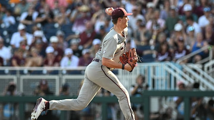 Jun 24, 2024; Omaha, NE, USA;  Texas A&M Aggies starting pitcher Justin Lamkin (33) throws against the Tennessee Volunteers during the first inning at Charles Schwab Field Omaha. Mandatory Credit: Steven Branscombe-Imagn Images