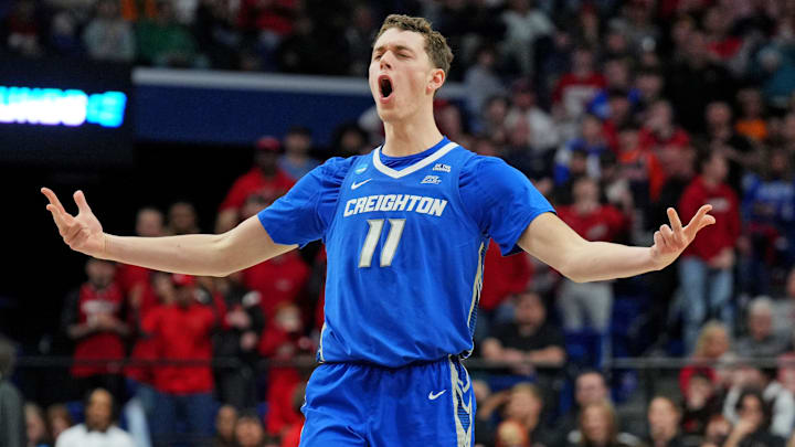 Mar 20, 2025; Lexington, KY, USA; Creighton Bluejays center Ryan Kalkbrenner (11) celebrate after making a three pointer during the second half against the Louisville Cardinals in the first round of the NCAA Tournament at Rupp Arena. Mar 20, 2025; Lexington, KY, USA; Creighton Bluejays center Ryan Kalkbrenner (11) celebrate after making a three pointer during the second half against the Louisville Cardinals in the first round of the NCAA Tournament at Rupp Arena.