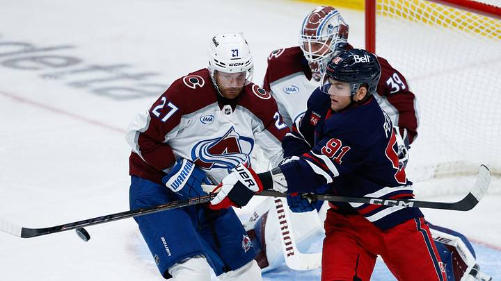 Oct 7, 2026; Winnipeg, Manitoba, CAN; Winnipeg Jets forward Cole Perfetti (91) jostles for position with Colorado Avalanche defenseman Brett Kulak (27) during the second period at Canada Life Centre. Mandatory Credit: Terrence Lee-Imagn Images Oct 7, 2026; Winnipeg, Manitoba, CAN; Winnipeg Jets forward Cole Perfetti (91) jostles for position with Colorado Avalanche defenseman Brett Kulak (27) during the second period at Canada Life Centre. Mandatory Credit: Terrence Lee-Imagn Images