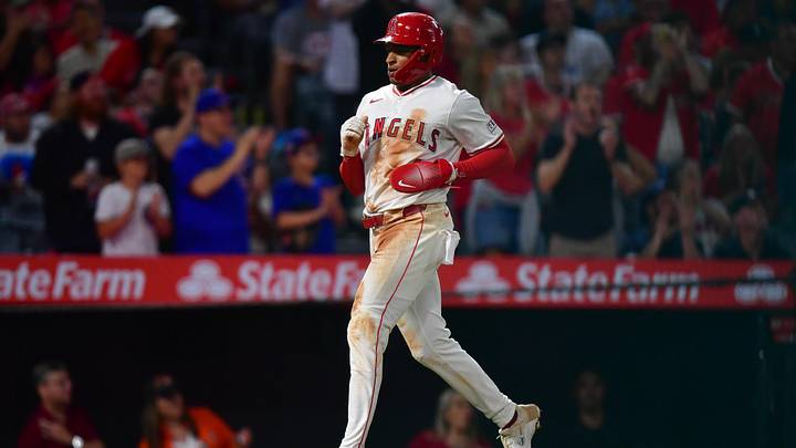 Sep 26, 2025; Anaheim, California, USA; Los Angeles Angels second baseman Christian Moore (4) scores a run against the Houston Astros during the fifth inning at Angel Stadium. Mandatory Credit: Gary A. Vasquez-Imagn Images