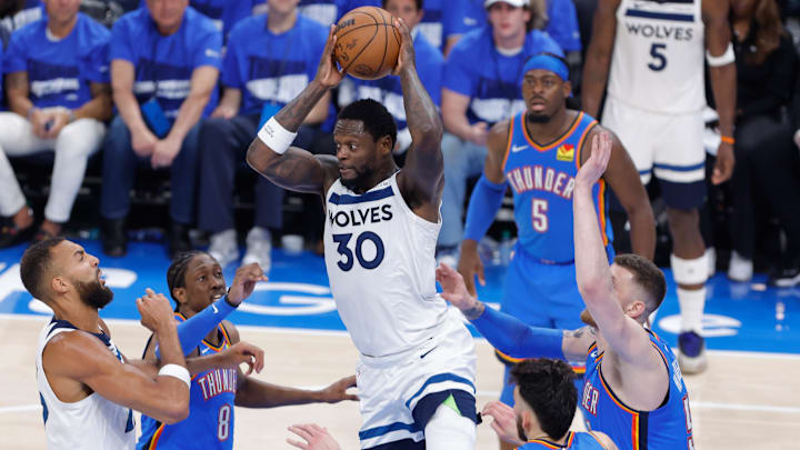 Minnesota Timberwolves forward Julius Randle rebounds against Oklahoma City Thunder forward Jalen Williams, left, forward Chet Holmgren, center, and center Isaiah Hartenstein in the second quarter during Game 2 of the Western Conference finals at Paycom Center in Oklahoma City on May 22, 2025. Minnesota Timberwolves forward Julius Randle rebounds against Oklahoma City Thunder forward Jalen Williams, left, forward Chet Holmgren, center, and center Isaiah Hartenstein in the second quarter during Game 2 of the Western Conference finals at Paycom Center in Oklahoma City on May 22, 2025.