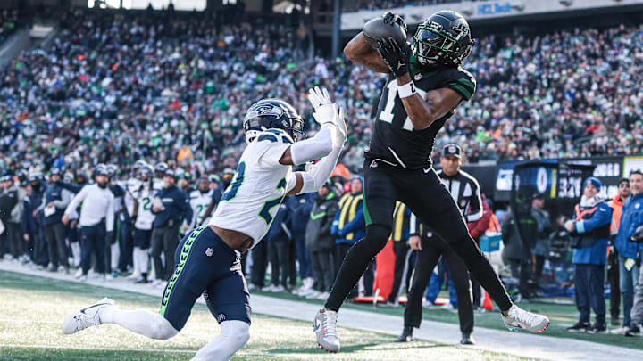 Dec 1, 2024; East Rutherford, New Jersey, USA; New York Jets wide receiver Davante Adams (17) catches a touchdown pass in front of Seattle Seahawks safety Julian Love (20) during the first quarter at MetLife Stadium. Mandatory Credit: Vincent Carchietta-Imagn Images Dec 1, 2024; East Rutherford, New Jersey, USA; New York Jets wide receiver Davante Adams (17) catches a touchdown pass in front of Seattle Seahawks safety Julian Love (20) during the first quarter at MetLife Stadium. Mandatory Credit: Vincent Carchietta-Imagn Images