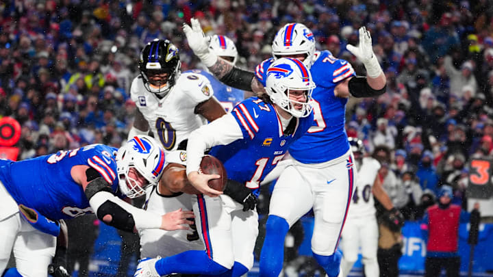 Jan 19, 2025; Orchard Park, New York, USA; Buffalo Bills quarterback Josh Allen (17) rushes for a touchdown during the second quarter against the Baltimore Ravens