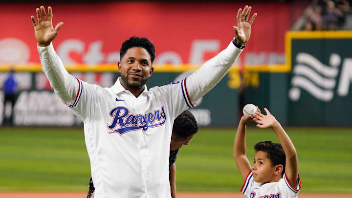 Sep 6, 2024; Arlington, Texas, USA; Former Texas Ranger Elvis Andres waves to fans after his son Elvis threw out the first pitch before the game between the Texas Rangers and the Los Angeles Angels at Globe Life Field. Andrus retired as a Texas Ranger after playing the first 12 seasons of his 15-year Major League career in Arlington. Sep 6, 2024; Arlington, Texas, USA; Former Texas Ranger Elvis Andres waves to fans after his son Elvis threw out the first pitch before the game between the Texas Rangers and the Los Angeles Angels at Globe Life Field. Andrus retired as a Texas Ranger after playing the first 12 seasons of his 15-year Major League career in Arlington.