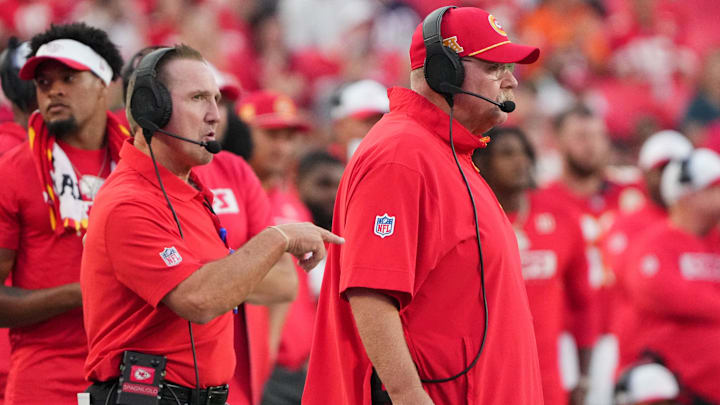 Aug 22, 2024; Kansas City, Missouri, USA; Kansas City Chiefs defensive coordinator Steve Spagnuolo, left and head coach Andy Reid watch play against the Chicago Bears during the game at GEHA Field at Arrowhead Stadium. Mandatory Credit: Denny Medley-Imagn Images