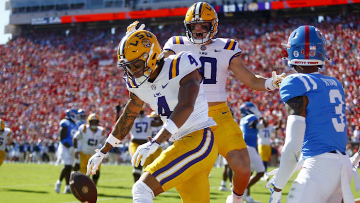 Sep 27, 2025; Oxford, Mississippi, USA; LSU Tigers wide receiver Nic Anderson (4) and tight end Bauer Sharp (10) react after Anderson’s touchdown catch during the first quarter against the Mississippi Rebels at Vaught-Hemingway Stadium. Mandatory Credit: Petre Thomas-Imagn Images Sep 27, 2025; Oxford, Mississippi, USA; LSU Tigers wide receiver Nic Anderson (4) and tight end Bauer Sharp (10) react after Anderson’s touchdown catch during the first quarter against the Mississippi Rebels at Vaught-Hemingway Stadium. Mandatory Credit: Petre Thomas-Imagn Images