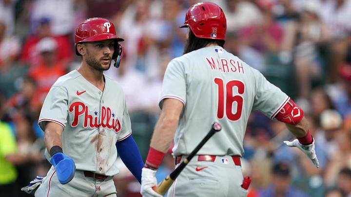 Jul 31, 2026; Baltimore, Maryland, USA; Philadelphia Phillies shortstop Trea Turner (7) celebrates with outfielder Brandon Marsh (16) after scoring a run during the first inning against the Baltimore Orioles at Oriole Park at Camden Yards. Mandatory Credit: Mitch Stringer-Imagn Images