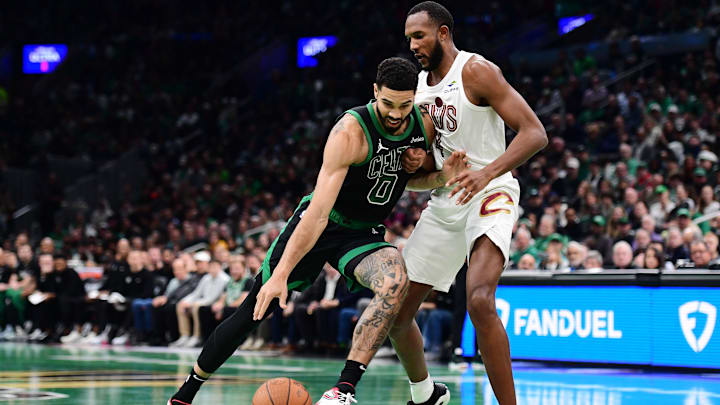 Nov 19, 2024; Boston, Massachusetts, USA; Boston Celtics forward Evan Mobley (4) defends (0) drives to the basket while Cleveland Cavaliers forward Evan Mobley (4) defends during the first half at TD Garden. Mandatory Credit: Bob DeChiara-Imagn Images