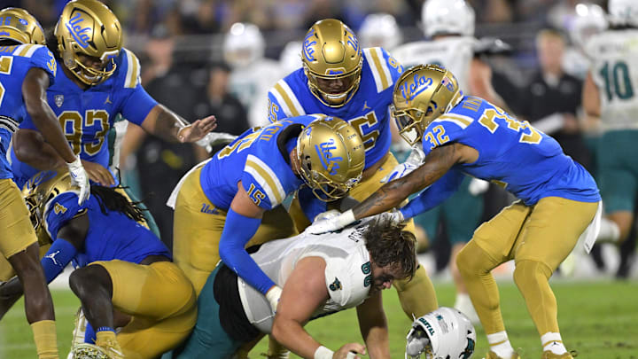 Sep 2, 2023; Pasadena, California, USA; Coastal Carolina Chanticleers offensive lineman Will McDonald (66) loses his helmet as he is stopped by the UCLA Bruins offense after an interception in the second half at Rose Bowl. Mandatory Credit: Jayne Kamin-Oncea-Imagn Images Sep 2, 2023; Pasadena, California, USA; Coastal Carolina Chanticleers offensive lineman Will McDonald (66) loses his helmet as he is stopped by the UCLA Bruins offense after an interception in the second half at Rose Bowl. Mandatory Credit: Jayne Kamin-Oncea-Imagn Images