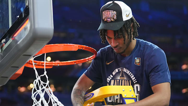 Connecticut Huskies guard Stephon Castle (5) cuts the basketball net after winning the Men's NCAA