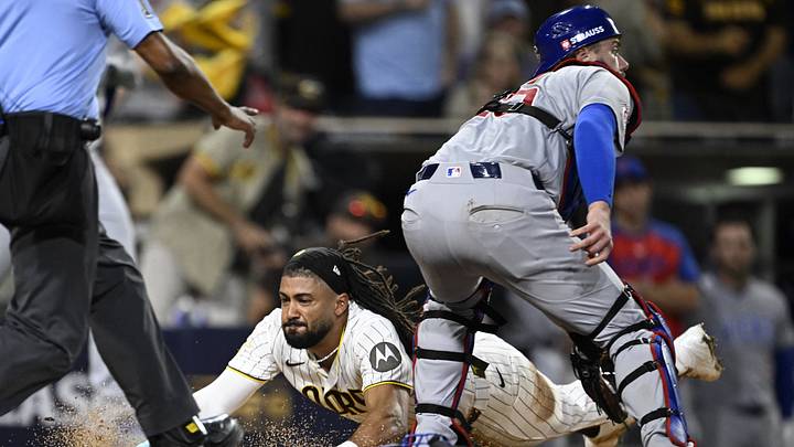 San Diego Padres outfielder Fernando Tatis Jr. slides home to score against the Chicago Cubs.