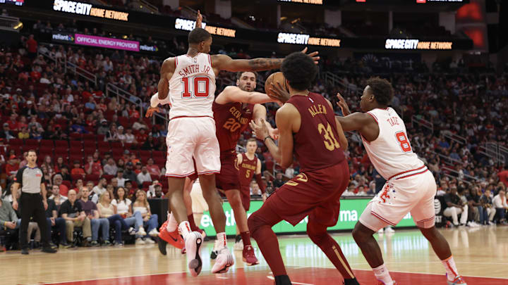 Mar 16, 2024; Houston, Texas, USA;  Cleveland Cavaliers forward Georges Niang (20) has his pass intercepted by Houston Rockets forward Jae'Sean Tate (8) in the fourth quarter at Toyota Center. Mandatory Credit: Thomas Shea-Imagn Images