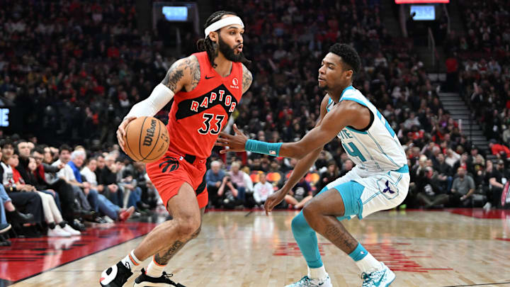 Mar 3, 2024; Toronto, Ontario, CAN; Toronto Raptors guard Gary Trent Jr. (33) dribbles the ball as Charlotte Hornets forward Brandon Miller (24) defends in the first half at Scotiabank Arena. Mandatory Credit: Dan Hamilton-USA TODAY Sports