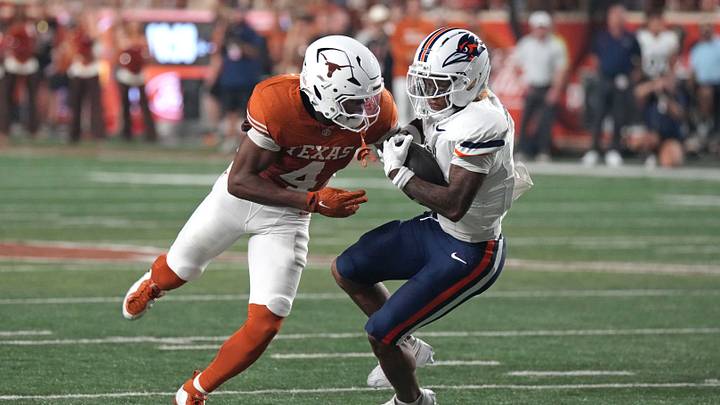 Texas Longhorns defensive back Jelani McDonald (4) hits UTSA Roadrunners running back Will Henderson III (1) for a tackle during the first half at Darrell K Royal-Texas Memorial Stadium. Texas Longhorns defensive back Jelani McDonald (4) hits UTSA Roadrunners running back Will Henderson III (1) for a tackle during the first half at Darrell K Royal-Texas Memorial Stadium.