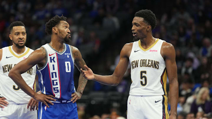 Dec 4, 2023; Sacramento, California, USA; Sacramento Kings guard Malik Monk (0) and New Orleans Pelicans forward Herbert Jones (5) talk during the fourth quarter at Golden 1 Center. Mandatory Credit: Darren Yamashita-Imagn Images