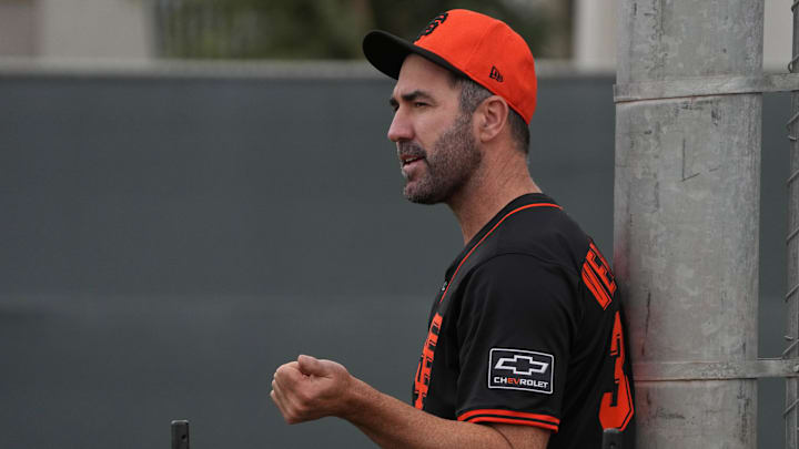 Feb 13, 2025; Scottsdale, AZ, USA; San Francisco Giants pitcher Justin Verlander (35) watches players work out in the bullpen during spring training camp. 