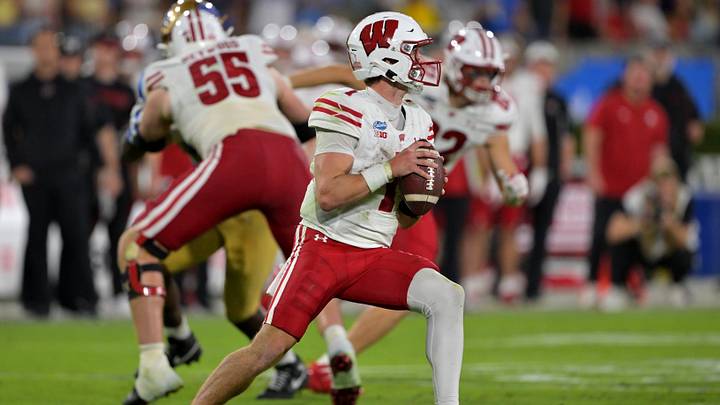 Oct 17, 2026; Pasadena, California, USA;  Wisconsin Badgers quarterback Colton Joseph (1) sets to pass in the second half against the UCLA Bruins at the Rose Bowl. Mandatory Credit: Jayne Kamin-Oncea-Imagn Images