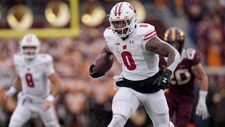 Wisconsin running back Braelon Allen (0) runs for a first down during the second quarter of their game Saturday, Nov. 25, 2023, at Huntington Bank Stadium in Minneapolis. Wisconsin running back Braelon Allen (0) runs for a first down during the second quarter of their game Saturday, Nov. 25, 2023, at Huntington Bank Stadium in Minneapolis.