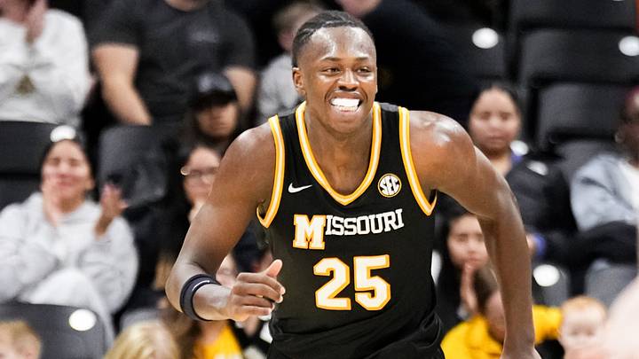 Jan 14, 2026; Columbia, Missouri, USA; Missouri Tigers guard Mark Mitchell (25) celebrates after dunking the ball against the Auburn Tigers during the second half of the game at Mizzou Arena. Mandatory Credit: Denny Medley-Imagn Images