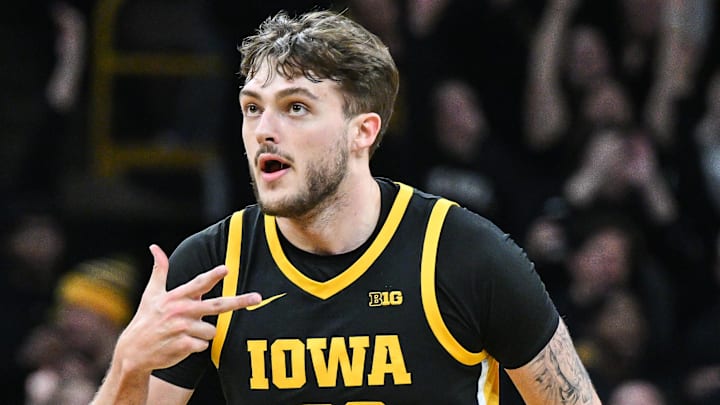 Dec 12, 2024; Iowa City, Iowa, USA; Iowa Hawkeyes forward Owen Freeman (32) reacts after hitting a three-point basket against the Iowa State Cyclones during the first half at Carver-Hawkeye Arena. Mandatory Credit: Jeffrey Becker-Imagn Images Dec 12, 2024; Iowa City, Iowa, USA; Iowa Hawkeyes forward Owen Freeman (32) reacts after hitting a three-point basket against the Iowa State Cyclones during the first half at Carver-Hawkeye Arena. Mandatory Credit: Jeffrey Becker-Imagn Images