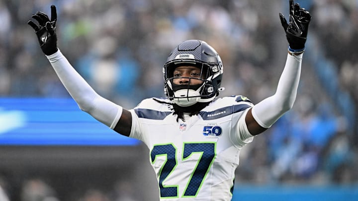 Dec 28, 2025; Charlotte, North Carolina, USA; Seattle Seahawks cornerback Riq Woolen (27) reacts against the Carolina Panthers during the second quarter at Bank of America Stadium. 