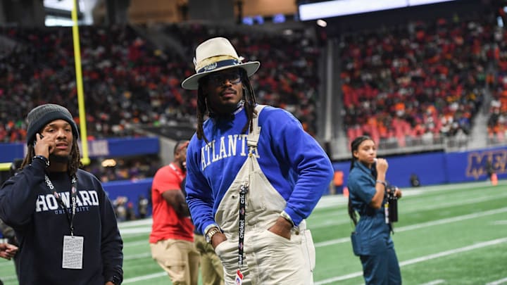 Cam Newton stands on the sidelines during the Cricket Celebration Bowl game between Florida A&M University and Howard University