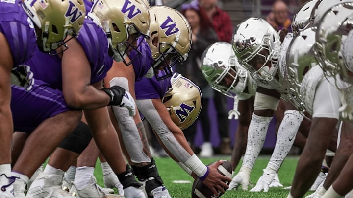 The Husky offensive line sets for a play against Oregon in 2023.