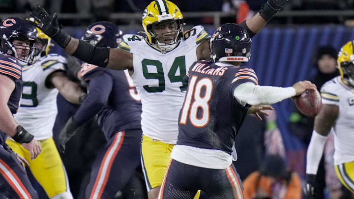 Green Bay Packers defensive end Karl Brooks (94) forces Chicago Bears quarterback Caleb Williams (18) two throw an interception during the third quarter of their wild card playoff game Saturday, January 10, 2026 at Soldier Field in Chicago, Illinois. The Chicago Bears beat the Green Bay Packers 31-27.