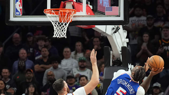 Nov 4, 2024; Phoenix, Arizona, USA; Philadelphia 76ers center Andre Drummond (5) shoots over Phoenix Suns center Jusuf Nurkic (20) during the first half at Footprint Center. Mandatory Credit: Joe Camporeale-Imagn Images