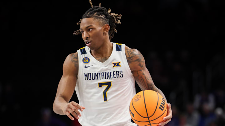 Mar 12, 2025; Kansas City, MO, USA; West Virginia Mountaineers guard Javon Small (7) brings the ball up court during the first half against the Colorado Buffaloes at T-Mobile Center. Mandatory Credit: William Purnell-Imagn Images