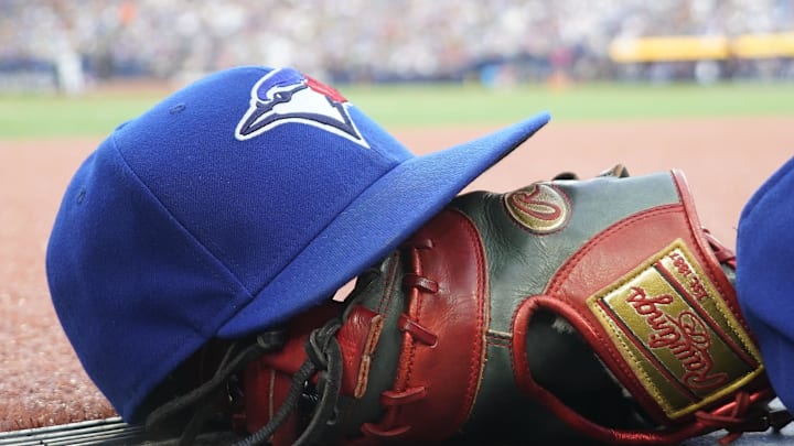 Jul 26, 2024; Toronto, Ontario, CAN; A Toronto Blue Jays hat and glove outside of the dugout during a game against the Texas Rangers at Rogers Centre. Mandatory Credit: John E. Sokolowski-Imagn Images Jul 26, 2024; Toronto, Ontario, CAN; A Toronto Blue Jays hat and glove outside of the dugout during a game against the Texas Rangers at Rogers Centre. Mandatory Credit: John E. Sokolowski-Imagn Images