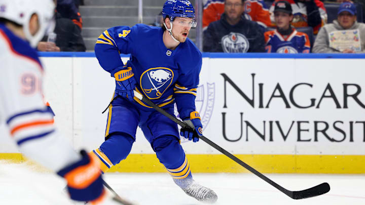 Nov 17, 2025; Buffalo, New York, USA;  Buffalo Sabres defenseman Bowen Byram (4) looks to make a pass during the second period against the Edmonton Oilers at KeyBank Center. Mandatory Credit: Timothy T. Ludwig-Imagn Images