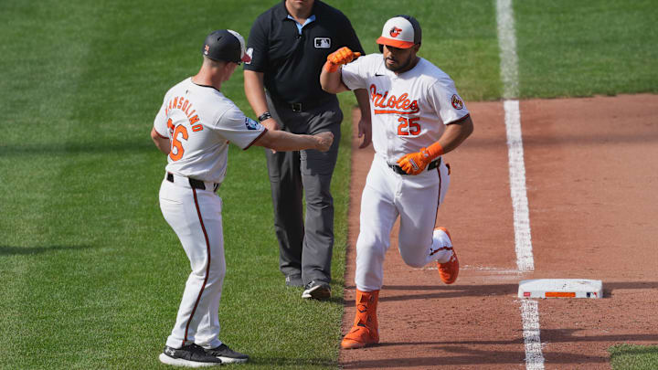 Sep 19, 2024; Baltimore, Maryland, USA; Baltimore Orioles designated hitter Anthony Santander (25) greeted by third base coach Tony Mansolino (36) following his game winning two run home run in the ninth inning against the San Francisco Giants at Oriole Park at Camden Yards.