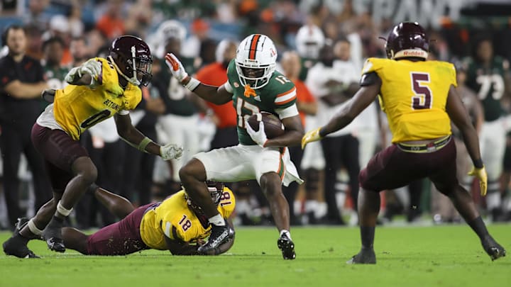 Sep 14, 2023; Miami Gardens, Florida, USA; Miami Hurricanes wide receiver Robby Washington (12) runs with the football against the Bethune Cookman Wildcats during the fourth quarter at Hard Rock Stadium. Mandatory Credit: Sam Navarro-Imagn Images Sep 14, 2023; Miami Gardens, Florida, USA; Miami Hurricanes wide receiver Robby Washington (12) runs with the football against the Bethune Cookman Wildcats during the fourth quarter at Hard Rock Stadium. Mandatory Credit: Sam Navarro-Imagn Images