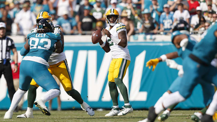 Oct 27, 2024; Jacksonville, Florida, USA; Green Bay Packers quarterback Malik Willis (2) looks for a pass against the Jacksonville Jaguars during the third quarter at EverBank Stadium. Mandatory Credit: Morgan Tencza-Imagn Images