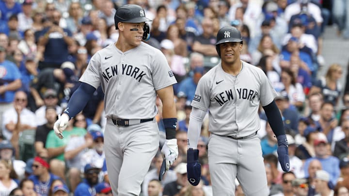 Sep 6, 2024; Chicago, Illinois, USA; New York Yankees outfielder Aaron Judge (99) and New York Yankees outfielder Juan Soto (22) celebrate after scoring agianst the Chicago Cubs during the third inning at Wrigley Field. Mandatory Credit: Kamil Krzaczynski-Imagn Images Sep 6, 2024; Chicago, Illinois, USA; New York Yankees outfielder Aaron Judge (99) and New York Yankees outfielder Juan Soto (22) celebrate after scoring agianst the Chicago Cubs during the third inning at Wrigley Field. Mandatory Credit: Kamil Krzaczynski-Imagn Images